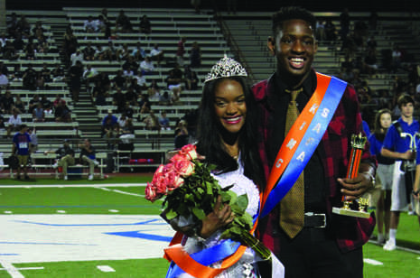 Seniors Esosa Oyemense and Briannah Collier are crowned Homecoming King and Queen at a game against Jesuit.