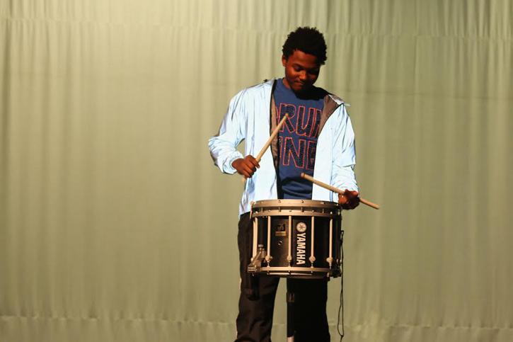 Senior Brandon Kitchin playing the drums during his routine.