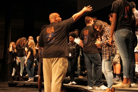 Mr. Lobaugh prepping the choirs during rehearsal.