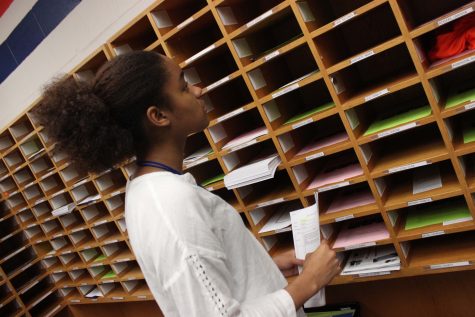 Senior Janaye Payne hard at work as an office aide. 