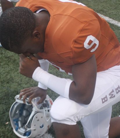 Khari Clarkson prays before his very last high school homecoming. 