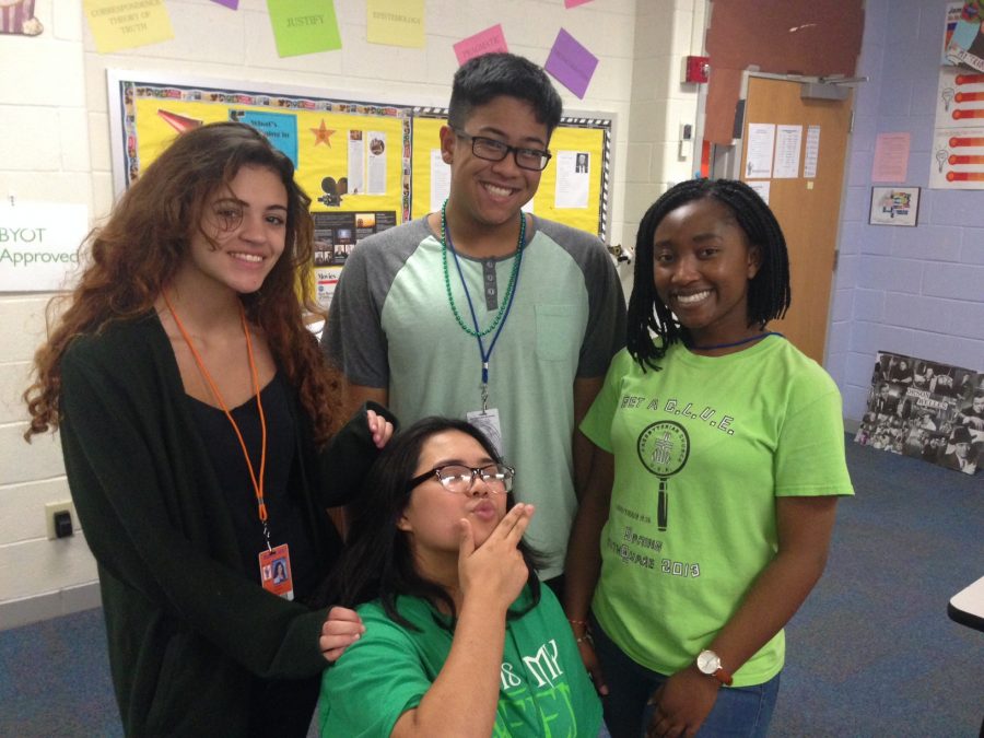 Seniors Ashley Cauthen, Peter Su, Madison Nguyen Ester Abaraoha dressed in their Green attire for Green Day.