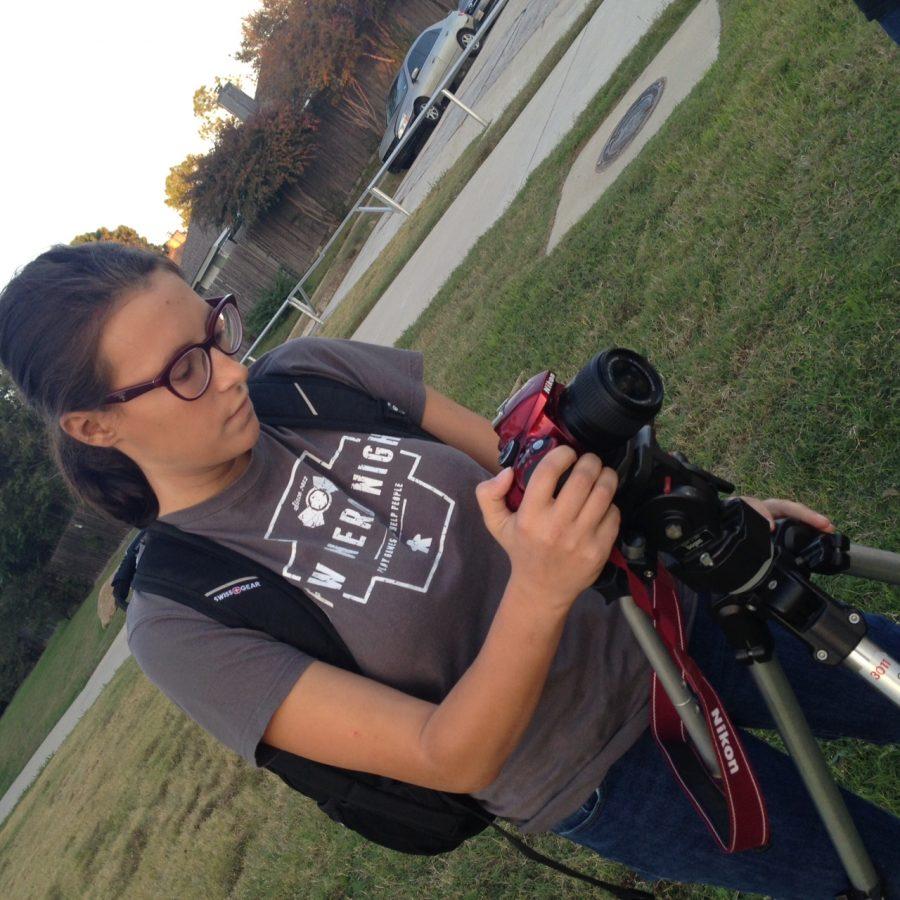 IB Senior Sarah Godfrey, sets up her camera to film part of her short film, her IB Film internal assessment. 