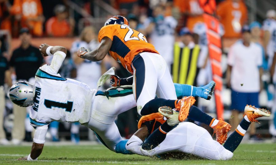 Sep 8, 2016; Denver, CO, USA; Carolina Panthers quarterback Cam Newton (1) is hit by Denver Broncos free safety Darian Stewart (26) in the fourth quarter at Sports Authority Field at Mile High. Mandatory Credit: Isaiah J. Downing-USA TODAY Sports